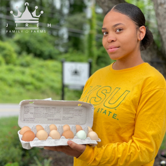 Woman holding carton of eggs